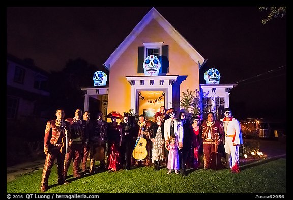 Halloween revelers and decorated house. Petaluma, California, USA (color)