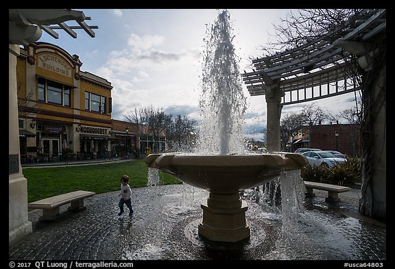 Fountain and plaza with child playing. Livermore, California, USA (color)