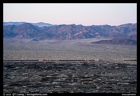 Freigh train and desert mountains. Mojave Trails National Monument, California, USA