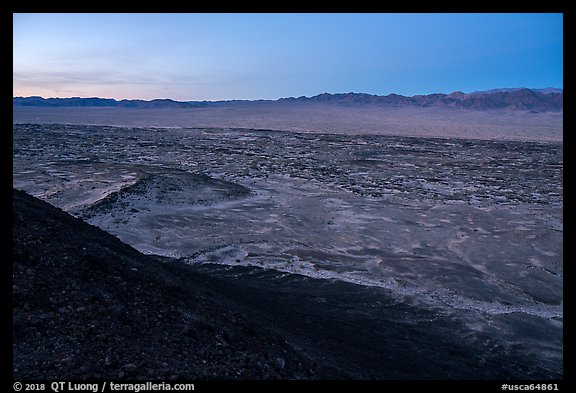 Lava field and mountains from Amboy Crater at dusk. Mojave Trails National Monument, California, USA