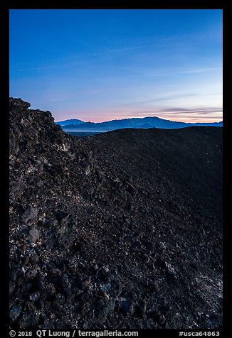 Interior slopes of Amboy Crater and mountains at dusk. Mojave Trails National Monument, California, USA