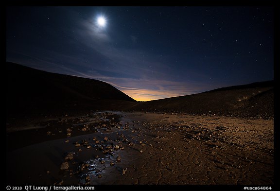 Moon shining inside Amboy Crater at night. Mojave Trails National Monument, California, USA