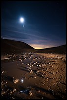 Puddle and cracked mud in Amboy Crater at night. Mojave Trails National Monument, California, USA ( color)