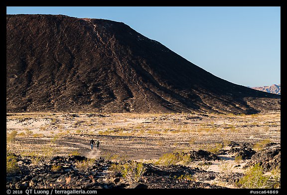 Hikers on Western Cone Trail, Amboy Crater. Mojave Trails National Monument, California, USA