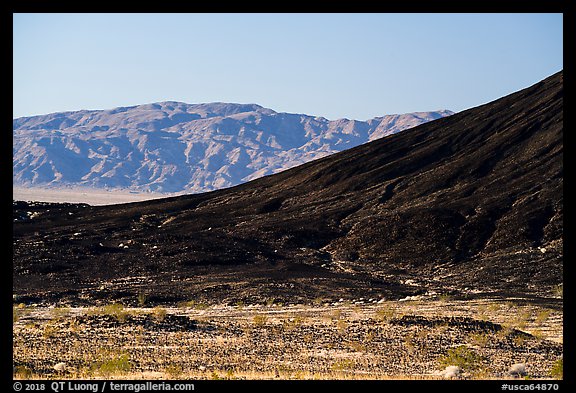 Amboy Crater slope and mountains. Mojave Trails National Monument, California, USA
