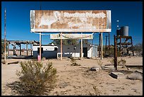 Old billboard and abandonned gas station. Mojave Trails National Monument, California, USA ( color)