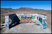 Aerial view of abandonned structure with graffiti and route 66 marker. Mojave Trails National Monument, California, USA ( color)