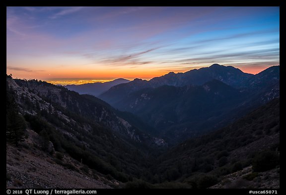 Mountains and distant Los Angeles Basin at sunset. San Gabriel Mountains National Monument, California, USA
