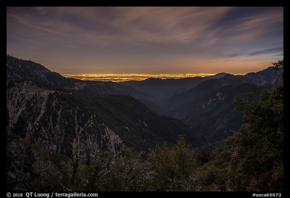 Mountains and distant Los Angeles Basin at night. San Gabriel Mountains National Monument, California, USA