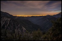 Mountains and distant Los Angeles Basin at night. San Gabriel Mountains National Monument, California, USA ( color)