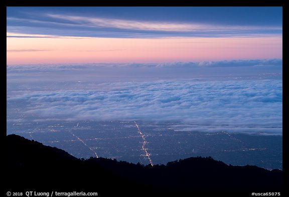 Low clouds above Los Angeles at sunrise from Mount Wilson. Los Angeles, California, USA