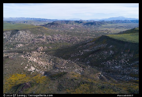 Aerial view of Black Lava Butte, boulders, and Flat Top Butte. Sand to Snow National Monument, California, USA (color)