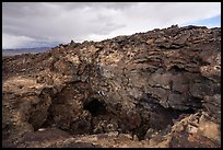 Depression and entrance to lava tube cave. Mojave Trails National Monument, California, USA ( color)