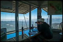 Fire lookout worker observing with binoculars. Giant Sequoia National Monument, Sequoia National Forest, California, USA ( color)