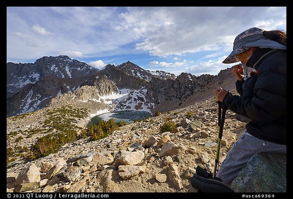 Hiker pauses above Big Pothole Lake, Inyo National Forest. California, USA (color)