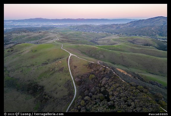 Aerial view of roads, gently rolling hills, with Salinas Valley in the distance. California, USA (color)