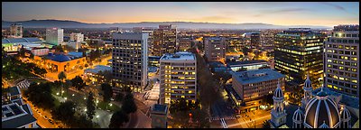 Downtown San Jose skyline and Santa Cruz Mountains at dusk. San Jose, California, USA (Panoramic color)