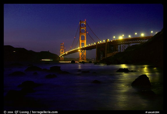 Golden Gate bridge and surf seen from E Baker Beach, night. San Francisco, California, USA (color)