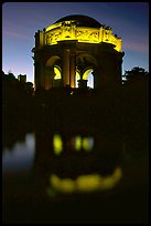 Rotunda of the Palace of Fine arts reflected in lagoon at  night. San Francisco, California, USA