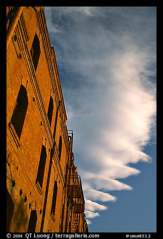 Old brick building and serrated cloud, sunset, Fisherman's Wharf. San Francisco, California, USA (color)