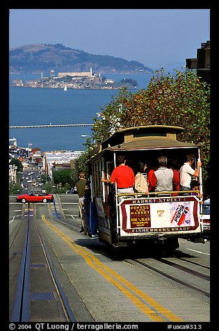Cable car on Hyde Street, with Alcatraz Island in the background. San Francisco, California, USA (color)