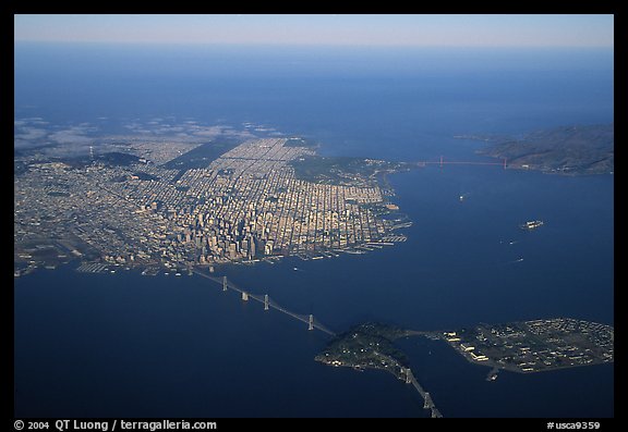 Aerial view of the Bay Bridge, the city, and  the Golden Gate Bridge. San Francisco, California, USA (color)