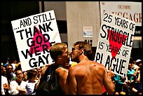 Gay couple with signs during the Gay Parade. San Francisco, California, USA ( color)
