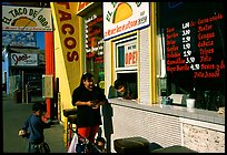 Hispanic women at a taco shop. Redwood City,  California, USA (color)