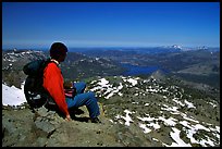 Hiker sitting  on top of Round Top Mountain. Mokelumne Wilderness, Eldorado National Forest, California, USA ( color)