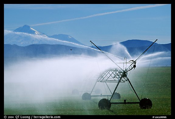 Irrigation machine and Mt Shasta. California, USA