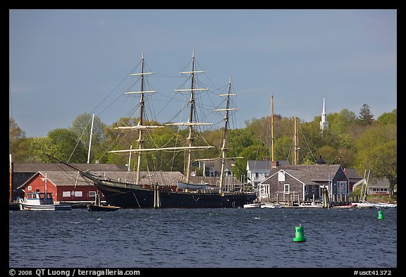 Three masted ship, Mystic River, and church. Mystic, Connecticut, USA