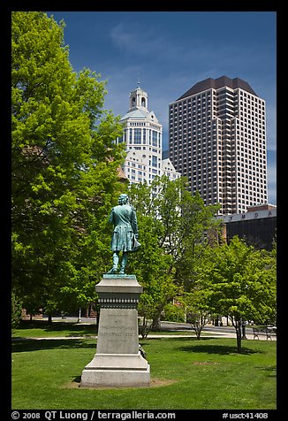 Statue in park and high-rise buildings. Hartford, Connecticut, USA (color)