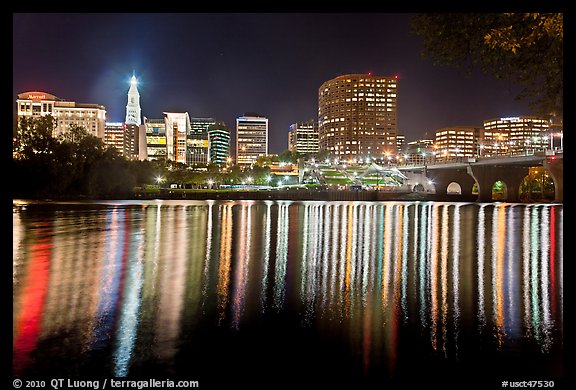 Skyline of Hartford reflected in Connecticut River at night. Hartford, Connecticut, USA