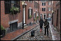 Women walking dog on rainy day, Beacon Hill. Boston, Massachussets, USA (color)
