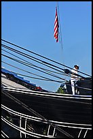 Sailor and flag on USS Constitution (9/11 10th anniversary). Boston, Massachussets, USA (color)