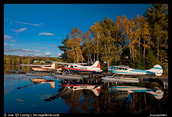 Floatplanes and reflections in Moosehead Lake  late afternoon, Greenville. Maine, USA (color)