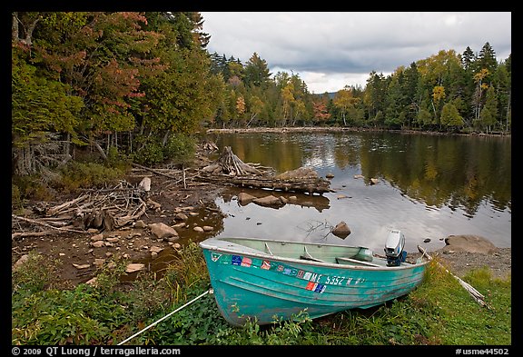 Cove and boat on shore of  Moosehead lake, Lily Bay State Park. Maine, USA