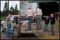 Game wardens check antler length of killed moose, Kokadjo. Maine, USA (color)