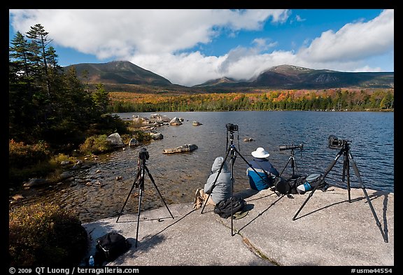 Photographers at Sandy Stream Pond waiting with cameras set up. Baxter State Park, Maine, USA (color)