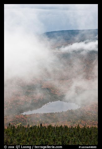 Clouds parting above Sandy Stream Pond. Baxter State Park, Maine, USA