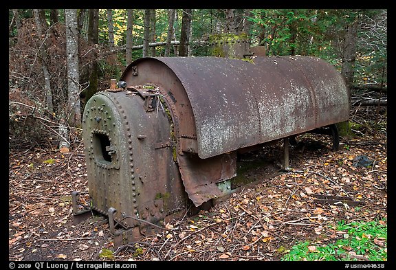 Steam engine remnant in forest. Allagash Wilderness Waterway, Maine, USA