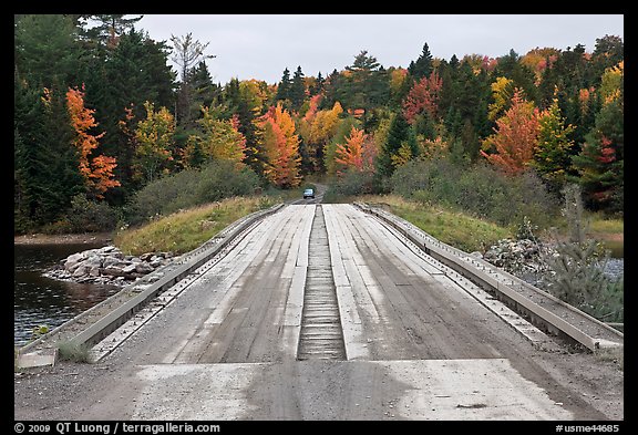 Wood bridge in the fall. Allagash Wilderness Waterway, Maine, USA (color)