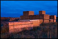 Stacks of finished lumber at dusk,  Ashland. Maine, USA ( color)