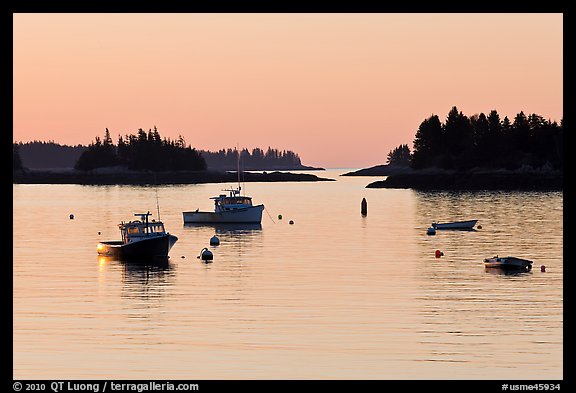 Boats and Penobscot Bay islets, sunrise. Stonington, Maine, USA