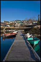Deck, small boats, and houses. Stonington, Maine, USA