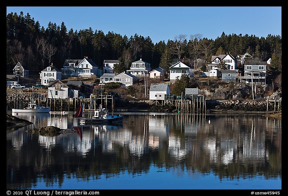 Reflection of hillside houses. Stonington, Maine, USA