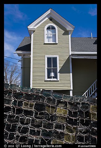 Lobster traps and house. Stonington, Maine, USA