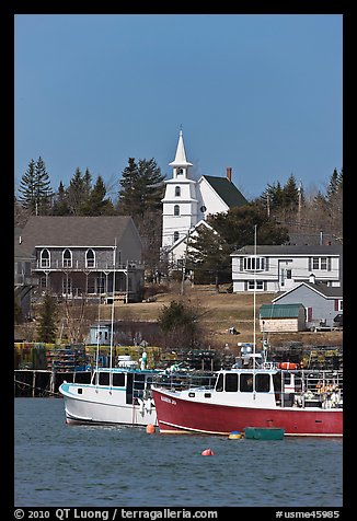 Lobster boats and village church. Corea, Maine, USA