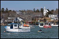 Lobsterman paddling towards boat. Corea, Maine, USA ( color)