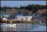 Men on small boat in harbor. Stonington, Maine, USA (color)